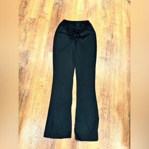 Black bootcut cinched v waist pants​​​​